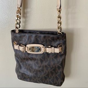 Brown bag with tan and gold accents.